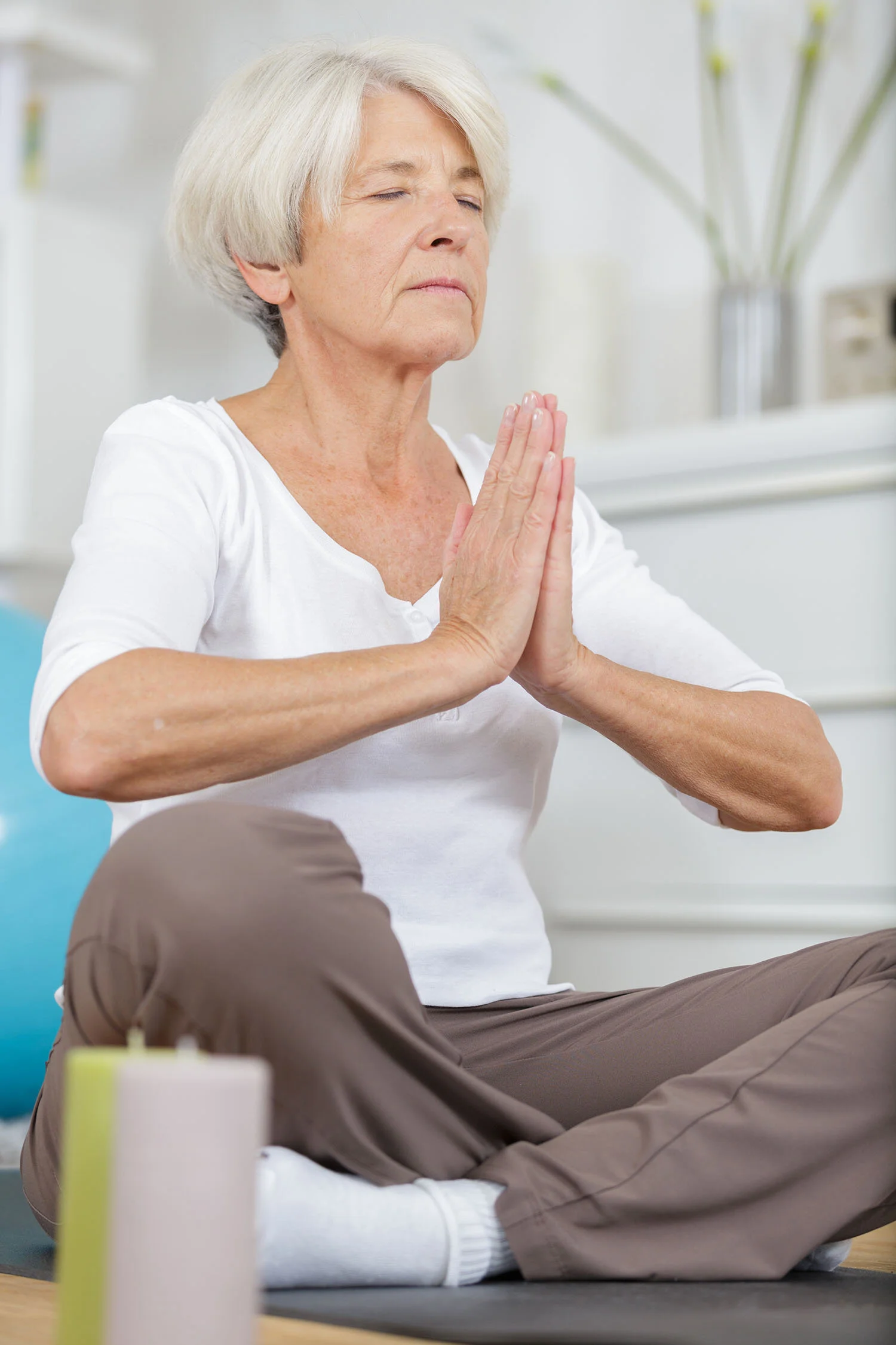 senior woman yoga prayer